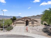 Charming single-story home featuring a desert landscape, attached garage, and beautiful mountain views at 16404 S 18Th Dr, Phoenix, AZ 85045