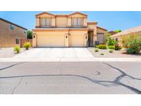 Charming two-story home boasts a spacious three-car garage and well-maintained landscaping at 3511 W Allens Peak Dr, San Tan Valley, AZ 85144