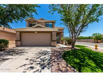 Charming two-story home with a two-car garage and well-maintained landscaping on a sunny day at 37911 N Luke Ln, San Tan Valley, AZ 85140
