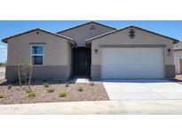 Charming single-story home featuring a two-car garage, low-maintenance landscaping, and a welcoming entrance at 3845 N Camden Dr, Florence, AZ 85132