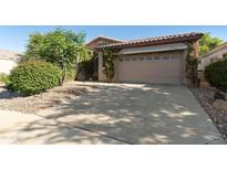 Charming home featuring a two-car garage with a driveway and mature landscaping at 4548 E Nightingale Ln, Gilbert, AZ 85298