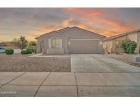 Charming single-story home featuring a two-car garage and low-maintenance landscaping at 7207 W Alta Vista Rd, Laveen, AZ 85339