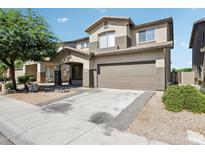 Charming two-story home featuring a two-car garage and well-maintained landscaping at 9420 S 35Th Gln, Laveen, AZ 85339