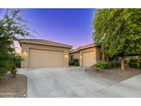 Stunning single-Gathering home with a three-car garage and low maintenance landscaping at 10440 W Swayback Pass, Peoria, AZ 85383