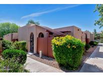 Charming single-story home with well-maintained landscaping and a private front patio at 1066 E Pueblo Rd, Phoenix, AZ 85020