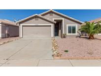 Charming single-story home with a two-car garage and well-maintained desert landscaping at 22039 N 35Th Dr, Glendale, AZ 85310