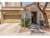 Inviting home exterior features a two-car garage and a charming walkway to the front door at 3131 E Legacy Dr # 2113, Phoenix, AZ 85042