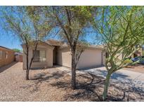 Charming single-story home with a well-manicured front yard and a two-car garage at 3313 W Wayland Dr, Phoenix, AZ 85041