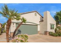 Charming single-Gathering home featuring desert landscaping, a two-car garage and a welcoming front entrance at 7031 S 32Nd Pl, Phoenix, AZ 85042