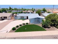 Charming single-story home featuring a well-manicured front yard with mature landscaping at 8750 E Starlight Way, Scottsdale, AZ 85250
