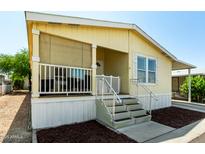 Inviting porch with screened walls and steps leading to the home's entryway at 8832 E Pueblo Ave # 71, Mesa, AZ 85208