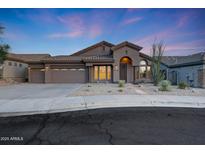 Charming single-story home featuring a desert landscape, stucco exterior, and a three-car garage at 10253 E Indigo Dr, Scottsdale, AZ 85255