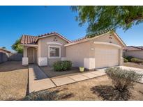 Charming single-story home featuring a well-maintained front yard and an attached two-car garage at 11845 W Edgemont Ave, Avondale, AZ 85392