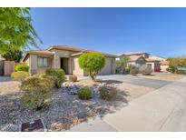 Charming single-story home with desert landscaping, stone accents, and a well-maintained front yard in a quiet neighborhood at 29356 N 67Th Ave, Peoria, AZ 85383