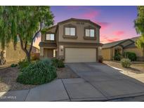 Charming two-story home with a two car garage, desert landscaping, and a cozy front porch at 3049 W Santa Cruz Ave, San Tan Valley, AZ 85144