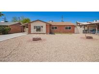 Charming single-story brick home with desert landscaping, creating an inviting curb appeal at 3644 W Maryland Ave, Phoenix, AZ 85019