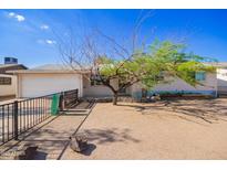 Charming home featuring a well-maintained exterior and a xeriscaped front yard for low-maintenance landscaping at 62 W Beall Ave, Mesa, AZ 85210