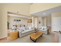 Bright and airy living room with open floor plan, neutral tones, and dining area at 705 W Queen Creek Rd # 1201, Chandler, AZ 85248