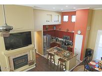Modern kitchen features granite counters, stainless appliances, and open layout, perfect for entertaining, adjacent to the living area at 15221 N Clubgate Dr # 2044, Scottsdale, AZ 85254