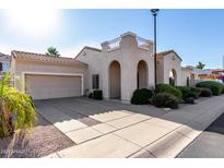 Attractive single-Gathering home with a beige exterior, arched entryway and concrete driveway at 16846 N 49Th Way, Scottsdale, AZ 85254