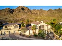 Aerial view of the home showing the roofline, driveway, and desert landscaping at 2326 E Gardenia Dr, Phoenix, AZ 85020