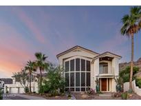 Elegant two-story home features a beautiful front yard, desert landscaping, and stylish architectural details at 2326 E Gardenia Dr, Phoenix, AZ 85020
