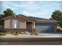 Charming single-story home featuring stone accents, a two-car garage, and professionally landscaped front yard at 37427 W San Sisto Ave, Maricopa, AZ 85138