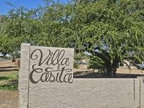 Entrance sign to the Villa Easita neighborhood with mature tree at 3807 W Mitchell Dr, Phoenix, AZ 85019