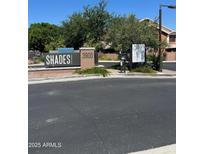 Attractive community signage at the entrance with well-maintained landscaping at 3900 E Baseline Rd # 166, Phoenix, AZ 85042