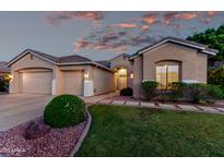 Charming single-story home featuring a well-manicured lawn, two-car garage, and inviting entrance at 4215 W Hackamore Dr, Phoenix, AZ 85083
