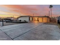 Charming single-story home features a spacious driveway and covered parking in a well-lit neighborhood at 1258 E Campus Dr, Tempe, AZ 85282