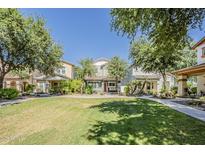 Charming homes with well-manicured lawns and mature trees in a welcoming community setting at 1482 S Banning St, Gilbert, AZ 85296