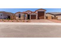 Charming single-Gathering home featuring a low-maintenance front yard and a two-car garage at 20262 W Monterey Way, Buckeye, AZ 85396