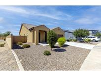 Inviting single-story home featuring desert landscaping, a private drive, and a neutral color scheme at 2430 E Alonso Dr, Casa Grande, AZ 85194