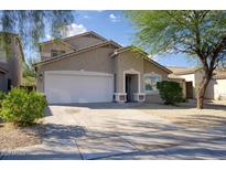 Charming one-story home featuring a stucco exterior, attached garage, and well-maintained landscaping in a desirable neighborhood at 2676 E Mineral Park Rd, San Tan Valley, AZ 85143