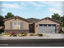 Charming single-story home with stone accents and a two-car garage in a Primary-planned community at 37174 W La Paz St, Maricopa, AZ 85138