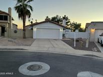 Charming single-story home featuring a desert-landscaped front yard and attached two-car garage at 1044 N Arvada N --, Mesa, AZ 85205