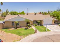 Charming single-story home featuring a well-manicured lawn and two-car garage at 1186 E Brenda Dr, Casa Grande, AZ 85122