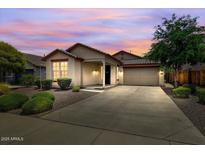 Charming single-story home featuring a well-manicured lawn, desert landscaping, and a two-car garage at 12775 W Lowden Rd, Peoria, AZ 85383