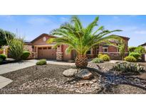 Charming single-story home featuring desert landscaping and a well-manicured front yard at 12903 W Brookhart Way, Peoria, AZ 85383