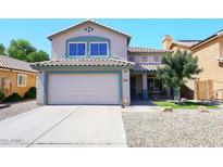 Two-story home featuring a neutral-toned exterior, tile roof, and a spacious two-car garage with driveway at 1640 W Gail Dr, Chandler, AZ 85224