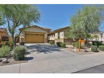 Charming single-Gathering home with a two-car garage and lush desert landscaping at 18108 W Thunderhill Pl, Goodyear, AZ 85338