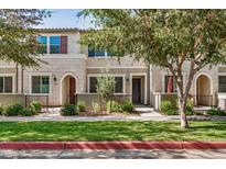 Inviting townhouse with well-maintained landscaping, enhancing curb appeal at 1825 E Hampton Ln # 108, Gilbert, AZ 85295