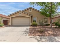 Charming single-story home featuring a two-car garage and well-maintained landscaping at 29151 N Lilly Ln, San Tan Valley, AZ 85143