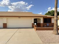 Charming single-story home featuring a well-maintained front yard, two-car garage, and cozy front porch at 8255 E Kiva Ave # 430, Mesa, AZ 85209