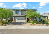 Beautiful two-story home with a two car garage and well maintained front yard landscaping at 8754 W San Juan Ave, Glendale, AZ 85305