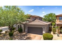 Charming single-story home with a well-manicured landscape and a two-car garage at 9904 E South Bend Dr, Scottsdale, AZ 85255