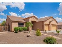 Charming single-story home featuring a stucco exterior, tile roof, and low-maintenance landscaping at 16609 N 40Th Dr, Phoenix, AZ 85053