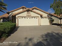 Charming single-story home with a three-car garage and well-manicured landscaping at 20641 N 110Th Ave, Peoria, AZ 85373