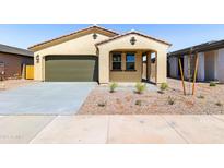 Charming single-story home featuring a stucco exterior, covered entryway, two-car garage, and low maintenance desert landscaping at 37582 W San Clemente St, Maricopa, AZ 85138